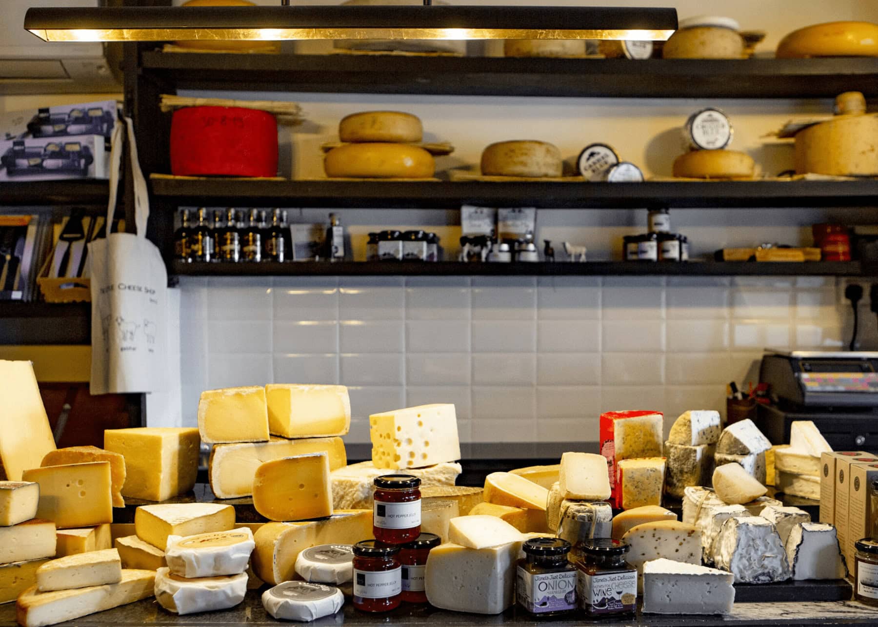 Selection of artisan cheeses, chutneys, and preserves on display at the local deli, The Little Cheese Shop, in Dingle.